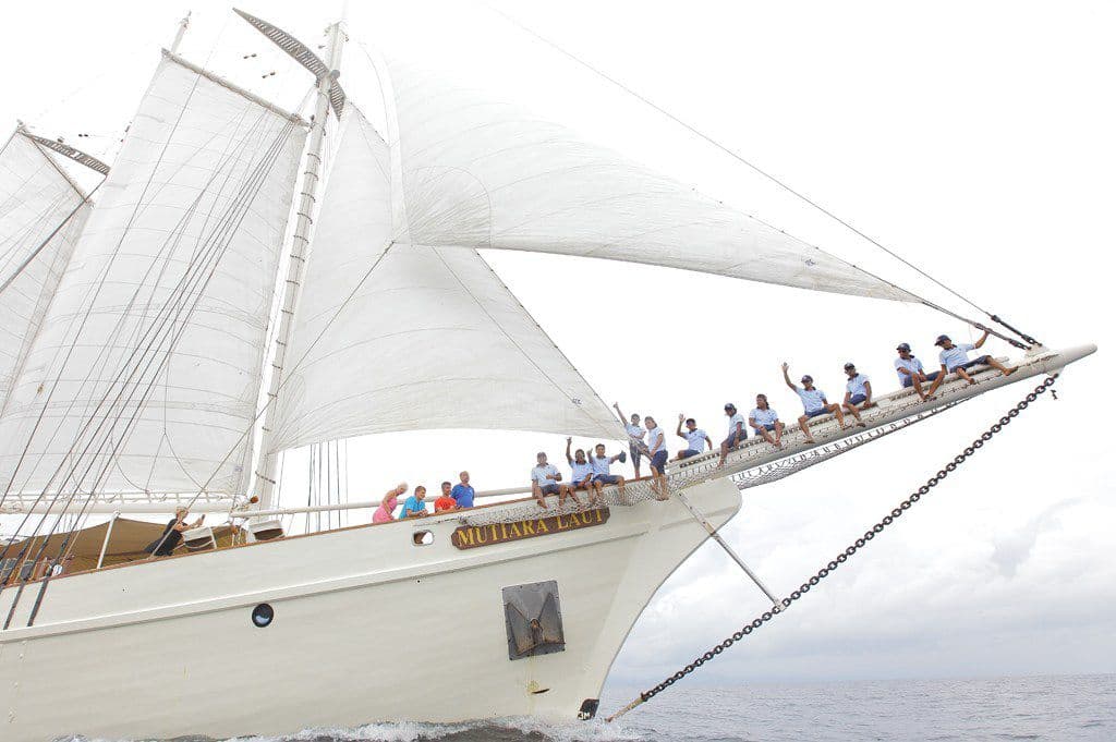 Mutiara Laut Yacht Crew And Guests On Bowsprit